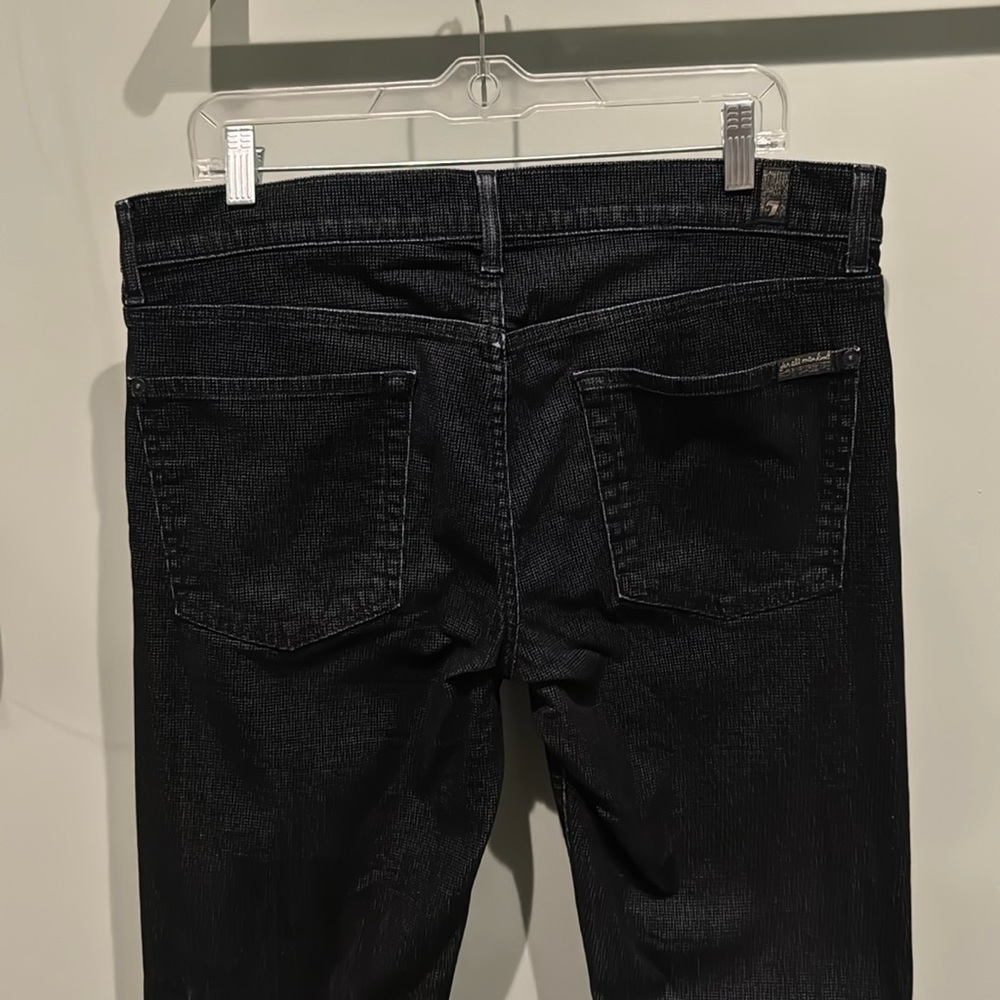 Great pants that are black with unique and incredible texture with white in it.